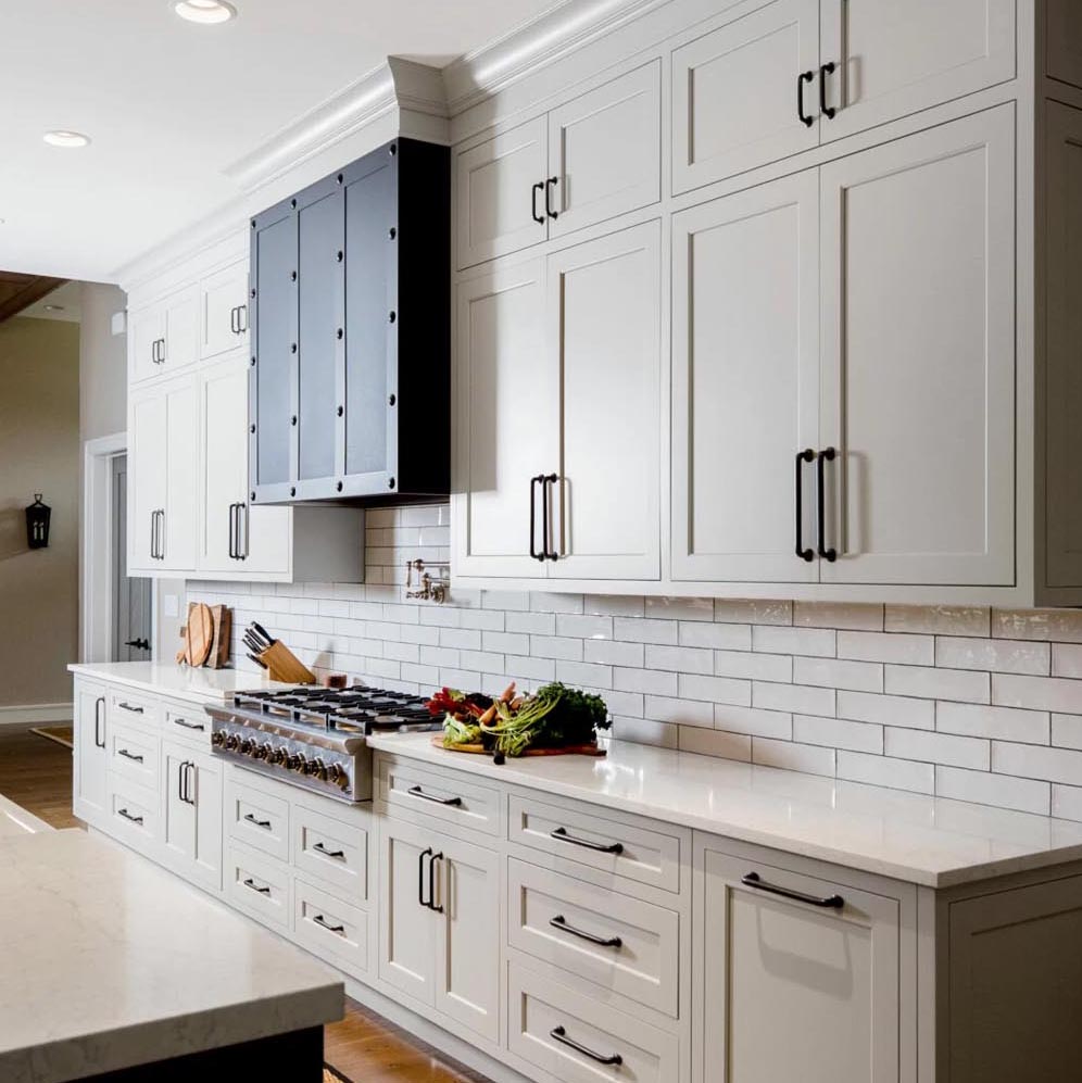 White kitchen cabinets with subway tile backsplash