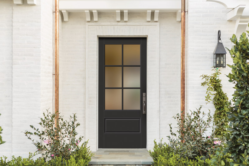 White front door with filigree wire pattern